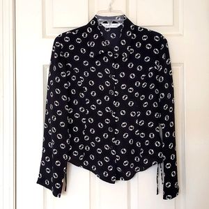 NWOT. Button-down shirt with waist design.